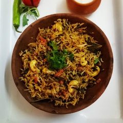 A picture of Methi Tomato Rice.