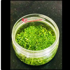 A picture of Homemade dried parsley leaves in microwave.