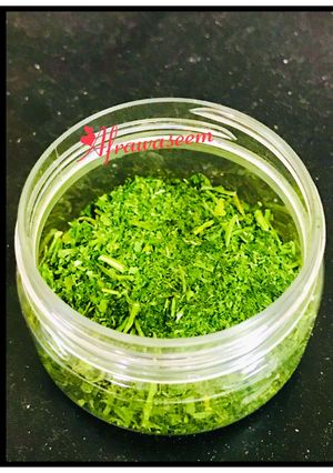 A picture of Homemade dried parsley leaves in microwave.
