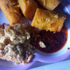 A picture of Ripe plantain with agoyin beans with stew.