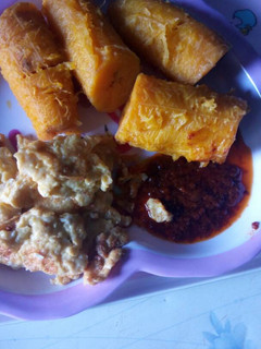 A picture of Ripe plantain with agoyin beans with stew.