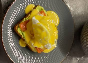 New Recipe Breakfast poached egg toast with avocado cream salmon and hollandaise Delicious Steady