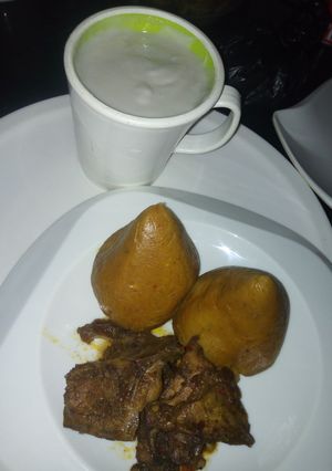 A picture of Moimoi (Alale) with kunun gyada and peppered chicken.