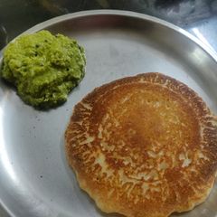 Instant rava coconut puda/aapam (pancake) with coconut chatani A picture of Instant rava coconut puda/aapam (pancake) with coconut chatani.