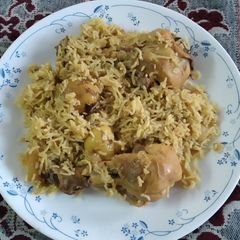 A picture of Chicken biryani with potatoes.