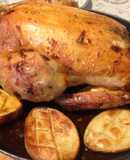 Pollo relleno con patatas asadas