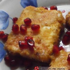 A picture of Fried feta cheese with pomegranate.
