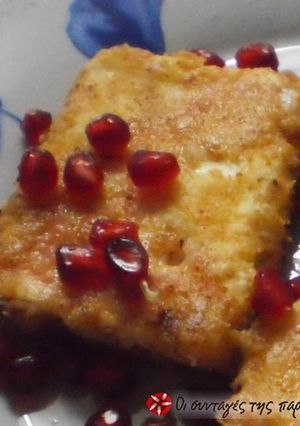 A picture of Fried feta cheese with pomegranate.