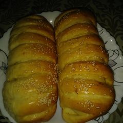 A picture of Chicken bread with white sauce filling.