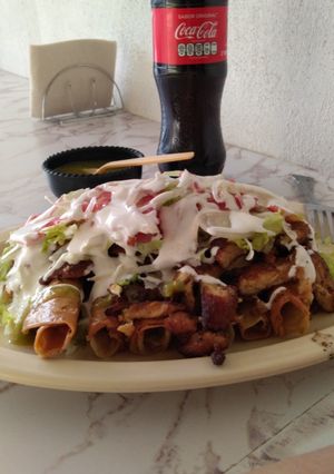 A picture of Potato Flautas with Breaded Cutlet.