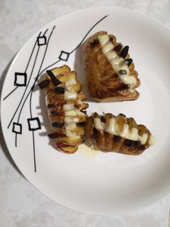 Una foto de Papas asadas con chorizo y queso