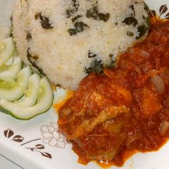 A picture of Dambun rice with stew.