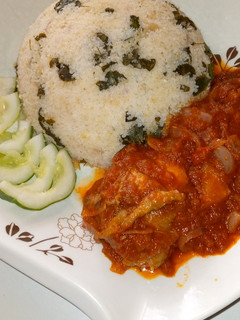 A picture of Dambun rice with stew.