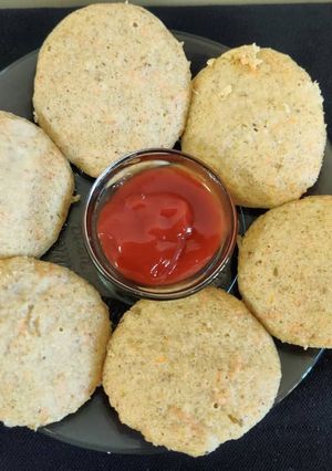 A picture of Moong dal carrot idli.