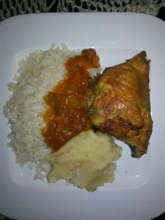 A picture of Tasty grilled chicken with rice and mashed potatoes.