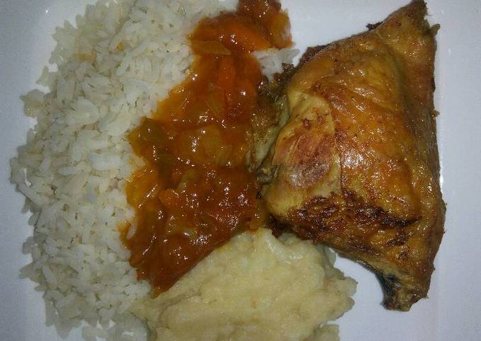 Tasty grilled chicken with rice and mashed potatoes