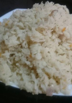 A picture of Basmati rice with onions and dill.