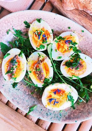 A picture of Boiled egg with anchovies.