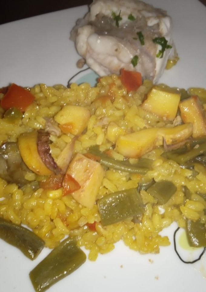 Una foto de Arroz con sepia y rape