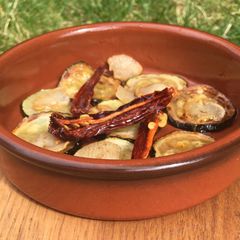 A picture of Tapas: Calabacin Al Ajillo 🌱 (courgette in garlic and hot chilli and paprika oil).