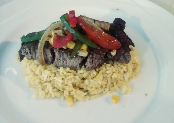 Steak & Turmeric Rice with Sauteed Corn, Onions & Pepprs