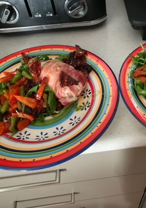 A picture of Chicken and Bacon stuffed with cream cheese.