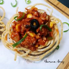 A picture of Spaghetti Nest with Drumsticks.