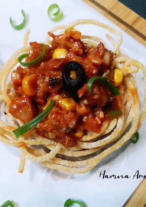 A picture of Spaghetti Nest with Drumsticks.