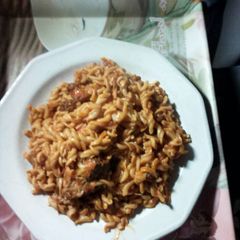 A picture of Macroni with chicken.