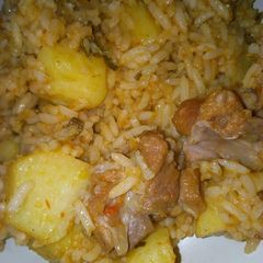 A picture of Jollof rice with potatoes.