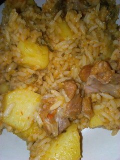A picture of Jollof rice with potatoes.