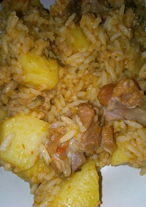 A picture of Jollof rice with potatoes.