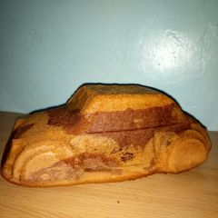 A picture of Car shaped cake.