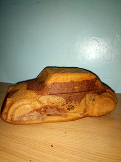 A picture of Car shaped cake.