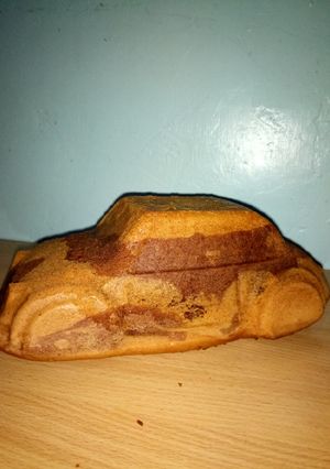 A picture of Car shaped cake.