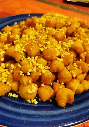 A picture of Neapolitan Struffoli with Pistachio Crumble.