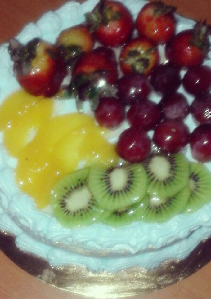 Una foto de Bizcocho con frutas exóticas al Rey