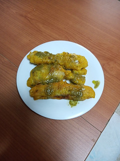 Una foto de Fogonero en gabardina con mojo verde