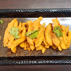 A picture of French fries fritters.