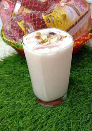 A picture of Curd Lassi with dry fruit.