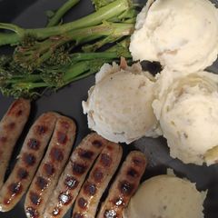 A picture of Skin-On Mashed Potatoes with Grilled Sausages and Tenderstem Broccoli.
