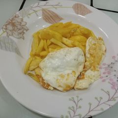 Fried potatoes with poached eggs A picture of Fried potatoes with poached eggs.