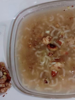 A picture of Maggi soup with roasted nuts and chicken 😋😋😋😋.