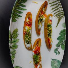 A picture of Raw banana chaat boats.