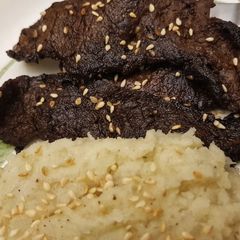 A picture of Steak stir fry with mashed Cauliflower.