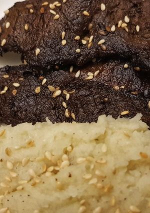 A picture of Steak stir fry with mashed Cauliflower.