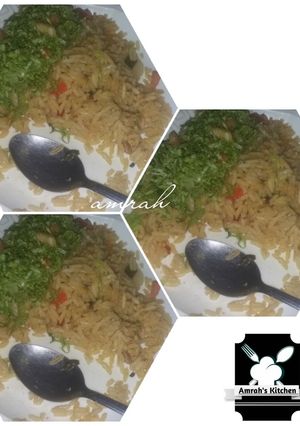 A picture of Jollof rice and salad.