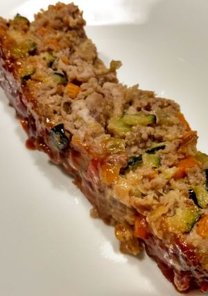 A picture of Meatloaf with veg and tangy glaze.