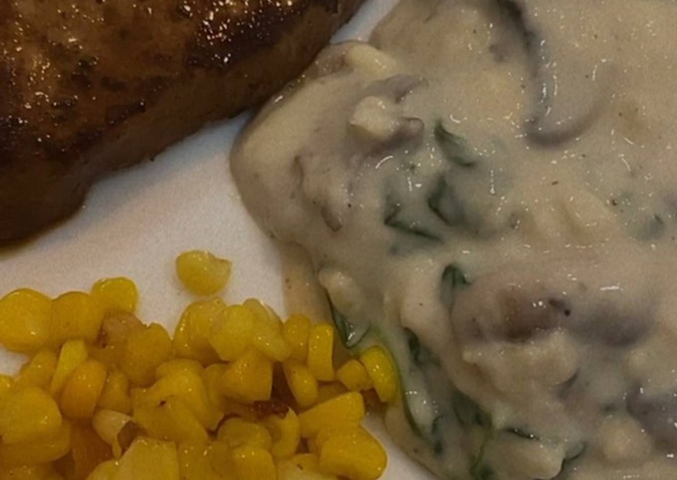 Sirloin steak with creamy spinach mushroom sauce