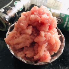 A picture of Homemade Ground Chicken (with a knife).